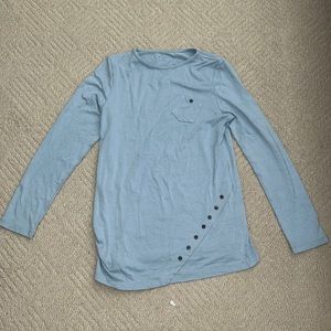 Light blue long-sleeved shirt with decorative buttons